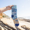 fun women's socks with an ocean scene and the words "the ocean just gets me"