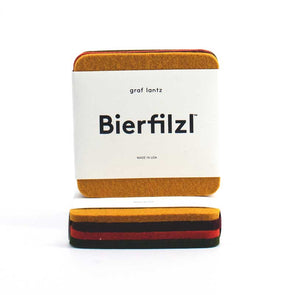 Set of four square merino wool felt coasters in “Spice” colors