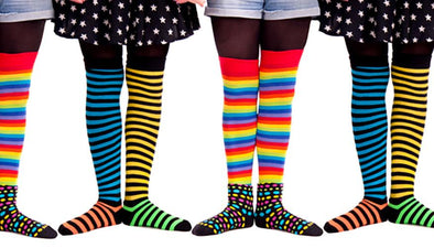people lined up wearing bright socks