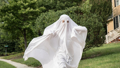 running in white sheet ghost costume