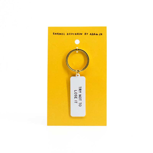 Funny, silver-colored keychain that says, “try not to lose it”