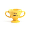 Tiny yellow trophy that says, “You tried”