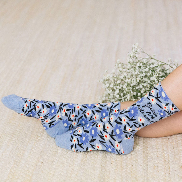 Bitch I Am Relaxed sock next to flowers