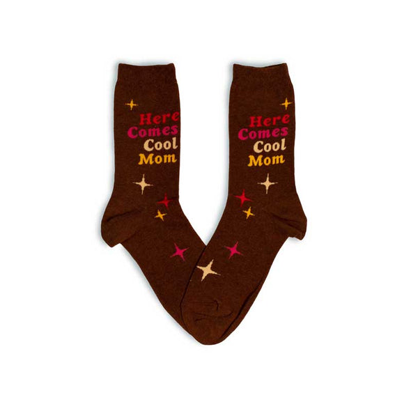 Funny women’s socks with a pattern of colorful stars and the words “here comes cool mom”