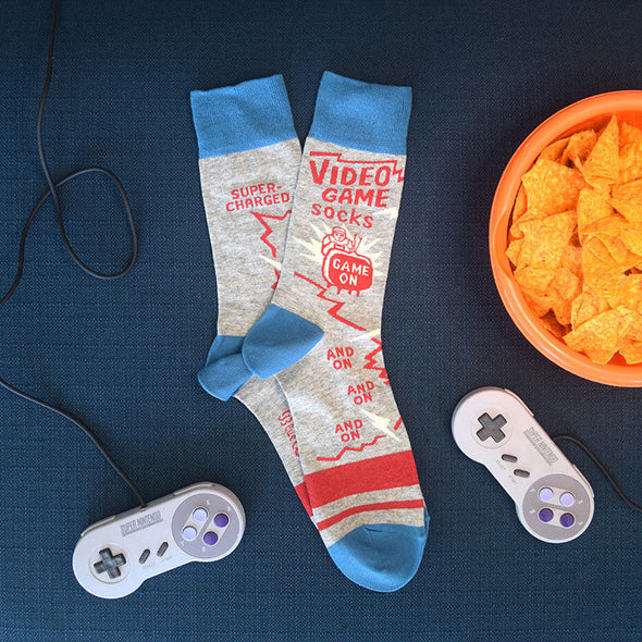 video game socks with controllers and a bowl of chips