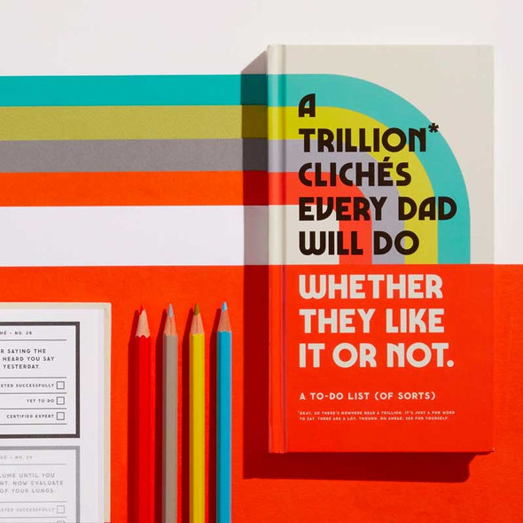 Funny journaling book of dad cliches with space for ratings and witness signatures alongside colored pencils
