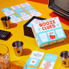 Cool game set that combines a drinking game with watching TV and movies, along with a glass of booze and a TV remote