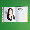 Open pages of illustrated history book that tells the stories of 100 remarkable women