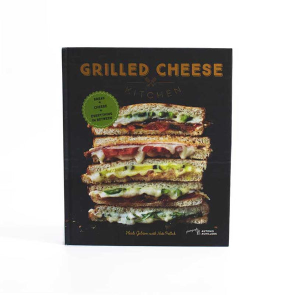 Cookbook with recipes for gourmet grilled cheese and full-color photographs