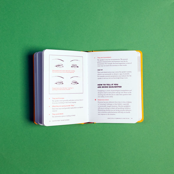 Open pages of funny, scary self-help book designed to help survive bad scenarios