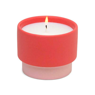 Scented candle in a pink textured ceramic vessel