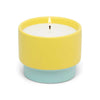 Scented candle in a yellow and mint green textured ceramic vessel