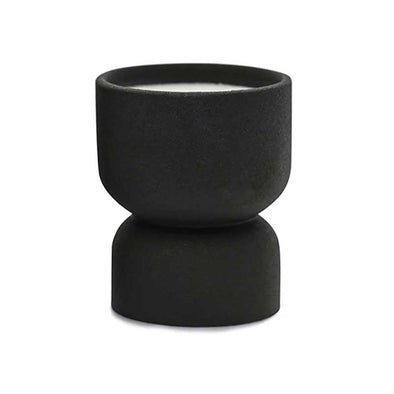 Scented candle in a matte black ceramic vessel