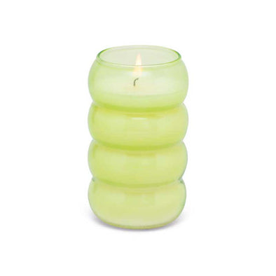 Scented green tea and melon candle in a green ribbed glass vessel