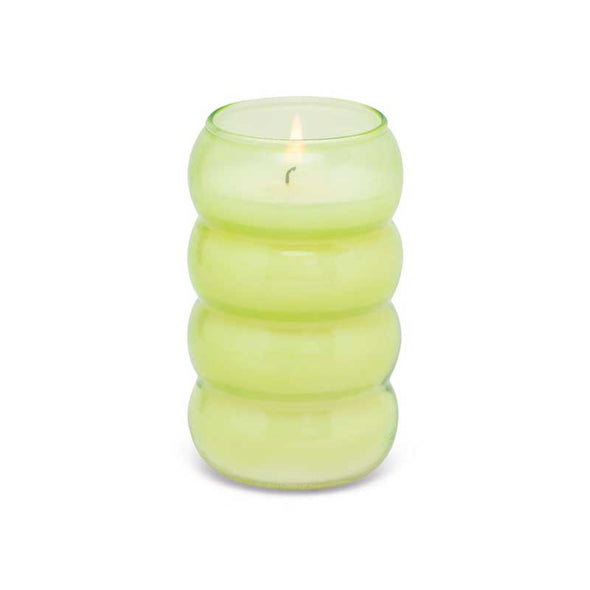Scented green tea and melon candle in a green ribbed glass vessel