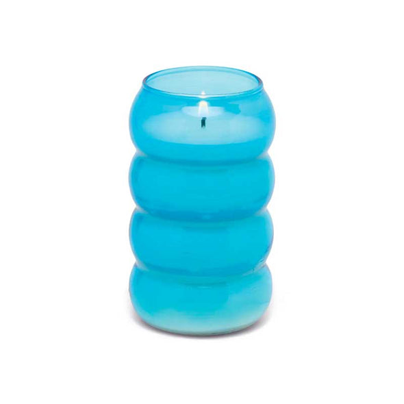 Scented candle in a blue ribbed glass vessel
