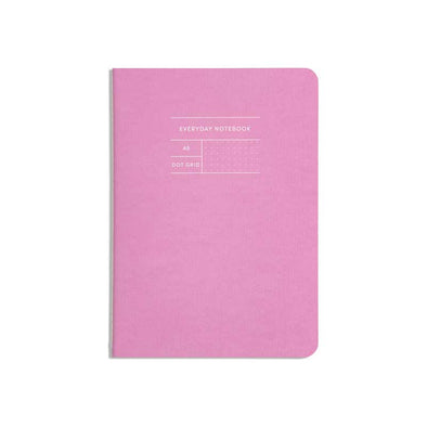 Classic notebook with pink cover and dotted pages