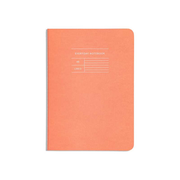 Classic notebook with orange cover and lined pages
