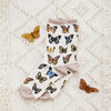 Pretty butterfly socks laying flat