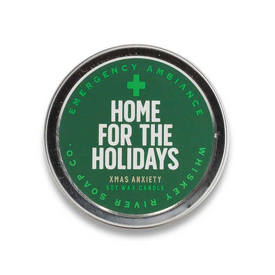 Funny, “Xmas anxiety” scented candle tin that says, “Home for the holidays” on the lid