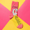 Always Be a Unicorn sock on yellow and pink paper