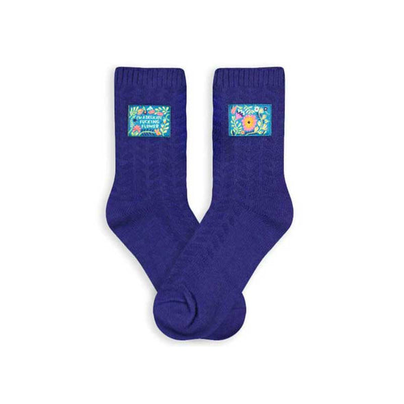 Solid, textured women’s socks with a small tag that reads, “I’m a delicate fucking flower”