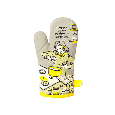 A funny oven mitt with a woman cooking and the words "Droppin' a new recipe on your ass"