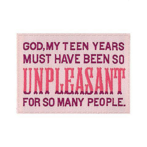 A close-up view of the tag that says, “God, my teen years must have been so unpleasant for so many people”