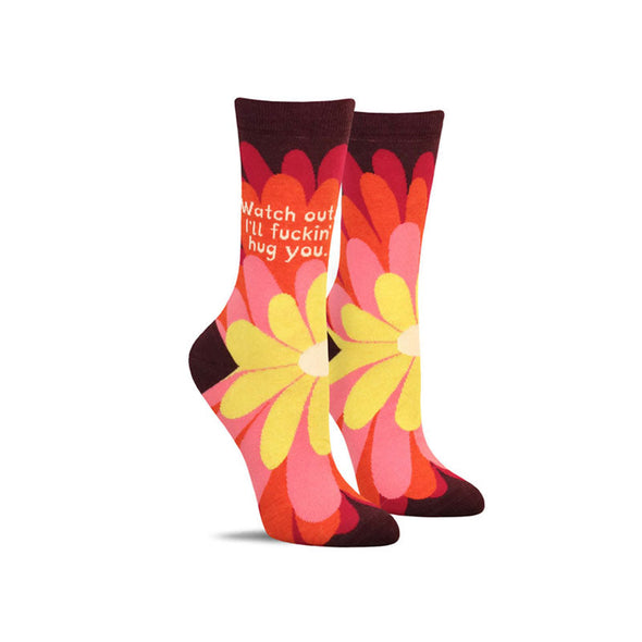Funny women’s socks with a flower design and the words, “Watch out. I’ll fuckin’ hug you”