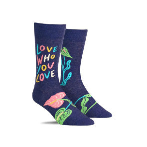 Inspirational men’s socks with a pattern of plant leaves and the words, “love who you love”