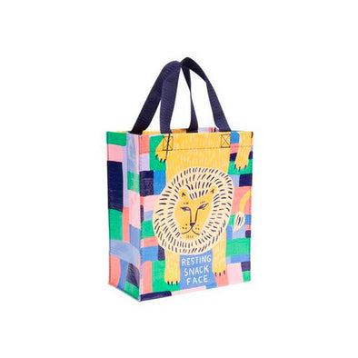 A funny lunch bag with a lion that says, "Resting snack face"