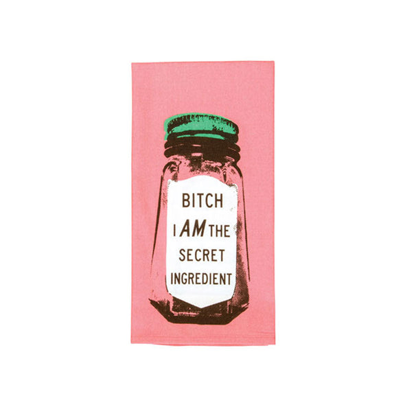 A funny dish towel with salt shakers on it that say, "Bitch, I AM the secret ingredient"
