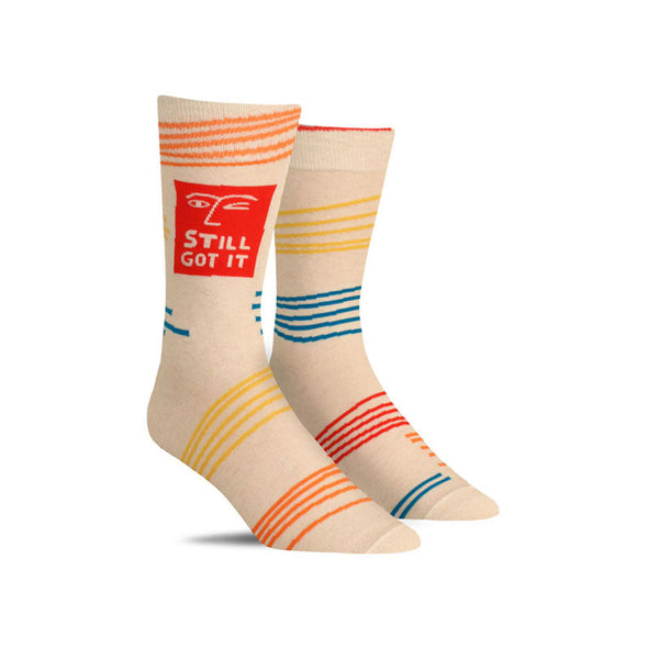 Funny men’s socks featuring a red square with a winking face and the words, “still got it”