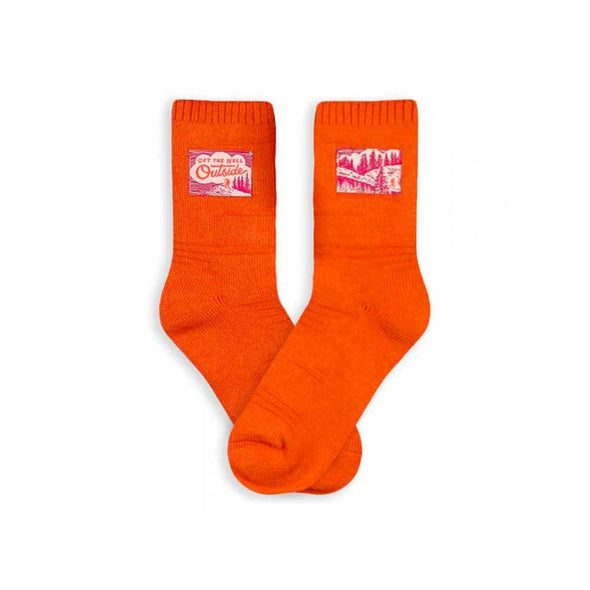 Textured orange socks with a small tag that says, “Get the hell outside”