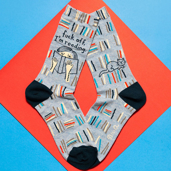 Sassy socks for women that say 'fuck off i'm reading'