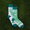 cool men's socks with the words "golf socks," "let it fly," "swing your thing" and "it's all mental"