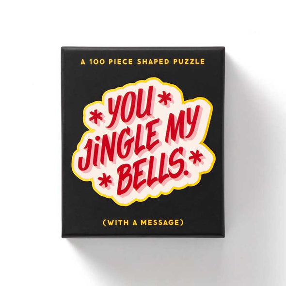 Shaped holiday jigsaw puzzle that says, “You Jingle My Bells”