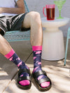 A man wearing fun flamingo novelty socks