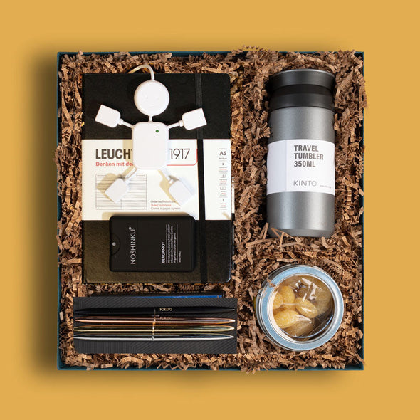 Curated corporate gift box from Goodly with office supplies, hand sanitizer and a travel tumbler