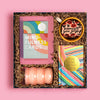 Elegant gift box of pink self-care items curated to raise awareness of breast cancer