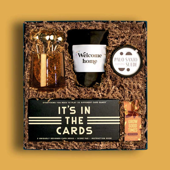 Unique housewarming gift box with coffee, decorations and games