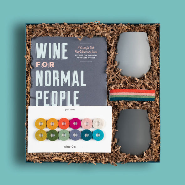 Goodly curated gift box with a book, wine glasses, coasters and other things for wine lovers