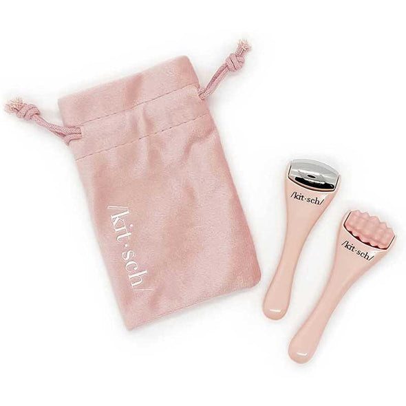 Two luxurious mini facial massage tools with a velvet carrying bag