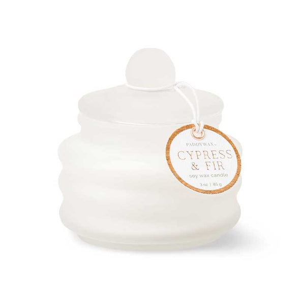 Small scented candle in a frosted white glass container