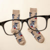 Funny men’s smart ass socks with a donkey wearing glasses laying flat