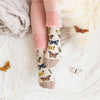 A woman wearing pretty butterfly socks