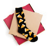 Flat lay view of cool men's socks that feature a pattern of pizza slices