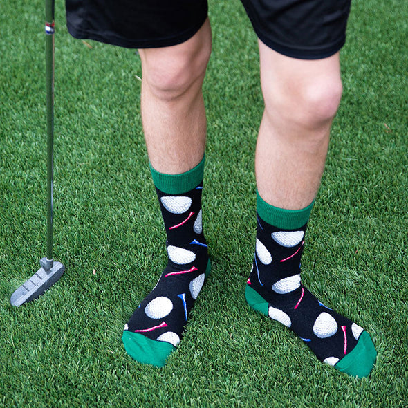 A man wearing golf socks in black