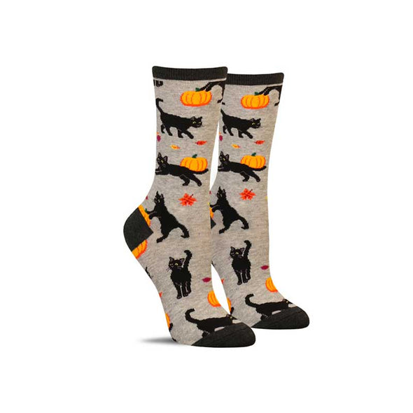 Fun women’s cat socks with a pattern of fall leaves, pumpkins and black cats