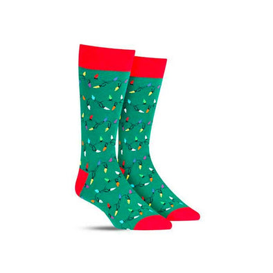 Green and red men's socks with strands of festive Christmas lights